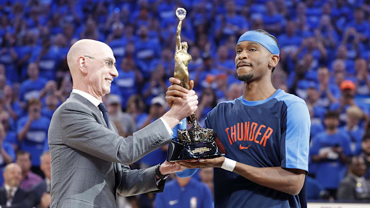 May 22, 2025; Oklahoma City, Oklahoma, USA; NBA commissioner Adam Silver presents Oklahoma City Thunder guard Shai Gilgeous-Alexander (2) with the Michael Jordan Trophy for winning the 2024-25 Most Valuable Player award before Game 2 of the Western Conference Finals at Paycom Center. Mandatory Credit: Alonzo Adams-Imagn Images