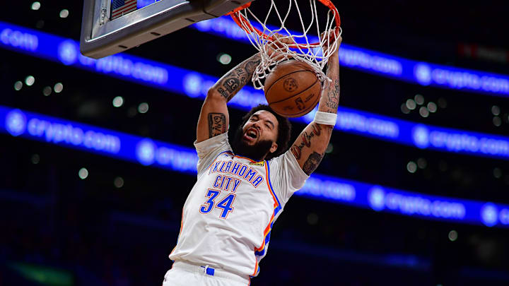 April 7, 2026; Los Angeles, California, USA; Oklahoma City Thunder guard Kenrich Williams (34) dunks for the basket against the Los Angeles Lakers during the second half at Crypto.com Arena.