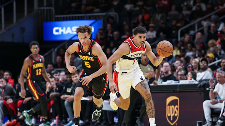 Nov 15, 2024; Atlanta, Georgia, USA; Atlanta Hawks guard Garrison Mathews (24) shoots the ball against Washington Wizards guard Carlton Carrington (8) during the first quarter at State Farm Arena. Mandatory Credit: Jordan Godfree-Imagn Images