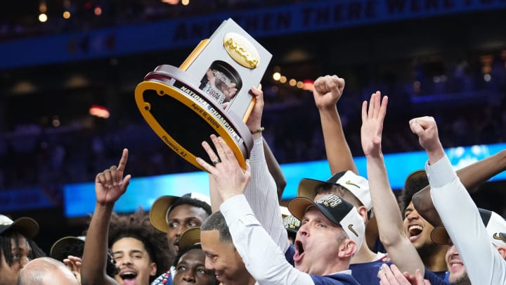 The Connecticut Huskies celebrate winning the men's NCAA national championship game against the Purdue Boilermakers.