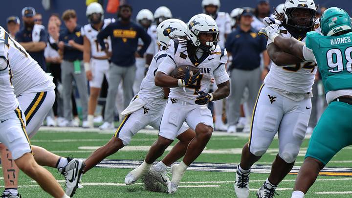 West Virginia University running back Cam Cook (4)