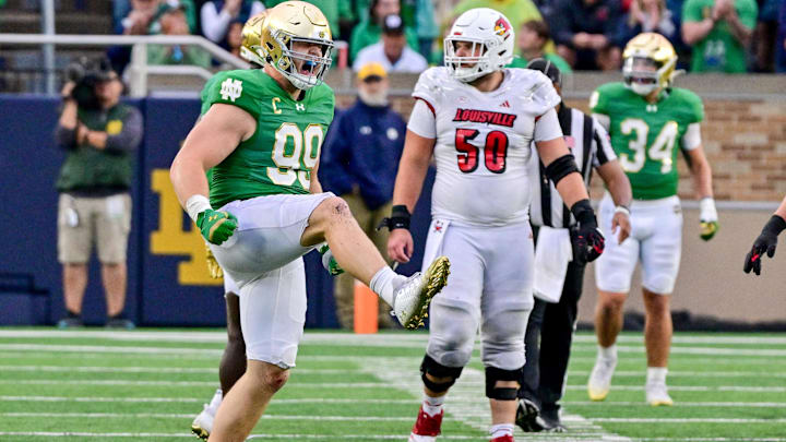 Sep 28, 2024; South Bend, Indiana, USA; Notre Dame Fighting Irish defensive lineman Rylie Mills (99) celebrates after a sack against the Louisville Cardinals in the fourth quarter at Notre Dame Stadium. Mandatory Credit: Matt Cashore-Imagn Images