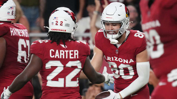 Arizona Cardinals receiver Simi Fehoko (80) celebrates his touchdown catch with teammate Michael Carter (22) as they play against the Las Vegas Raiders at State Farm Stadium in Glendale, on Aug. 23, 2025.