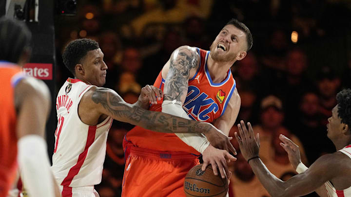 Dec 14, 2024; Las Vegas, Nevada, USA; Houston Rockets forward Jabari Smith Jr. (10) defends against Oklahoma City Thunder center Isaiah Hartenstein (55) during the fourth quarter in a semifinal of the 2024 Emirates NBA Cup at T-Mobile Arena. Mandatory Credit: Kyle Terada-Imagn Images