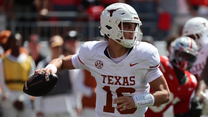 Texas Longhorns quarterback Arch Manning (16) drops back to pass against the Ohio State Buckeyes. Texas Longhorns quarterback Arch Manning (16) drops back to pass against the Ohio State Buckeyes.