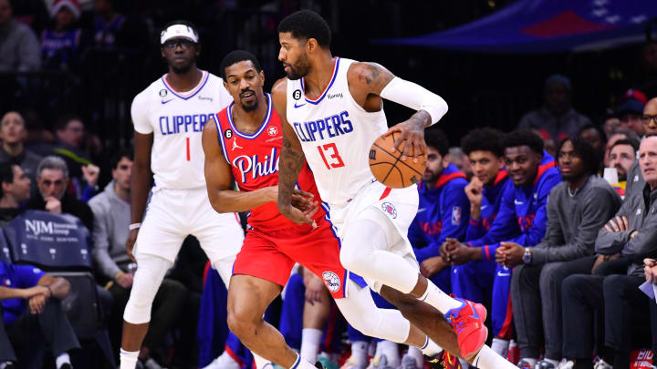 Dec 23, 2022; Philadelphia, Pennsylvania, USA; Los Angeles Clippers forward Paul George (13) drives against Philadelphia 76ers guard De'Anthony Melton (8) in the second quarter at Wells Fargo Center. Mandatory Credit: Kyle Ross-USA TODAY Sports