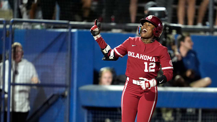 Oklahoma's Maya Bland (12) celebrates after hitting a three-run home run in the fourth inning of a college Bedlam softball game between the University of Oklahoma Sooners (OU) and the Oklahoma State University Cowgirls (OSU) at Devon Park in Oklahoma City, Wednesday, April 9, 2025.