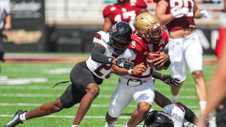 Sep 2, 2023; Chestnut Hill, Massachusetts, USA; Northern Illinois Huskies cornerback Jacob Finley (20) tackles Boston College Eagles quarterback Thomas Castellanos (1) during the first half at Alumni Stadium. Mandatory Credit: Paul Rutherford-Imagn Images Sep 2, 2023; Chestnut Hill, Massachusetts, USA; Northern Illinois Huskies cornerback Jacob Finley (20) tackles Boston College Eagles quarterback Thomas Castellanos (1) during the first half at Alumni Stadium. Mandatory Credit: Paul Rutherford-Imagn Images