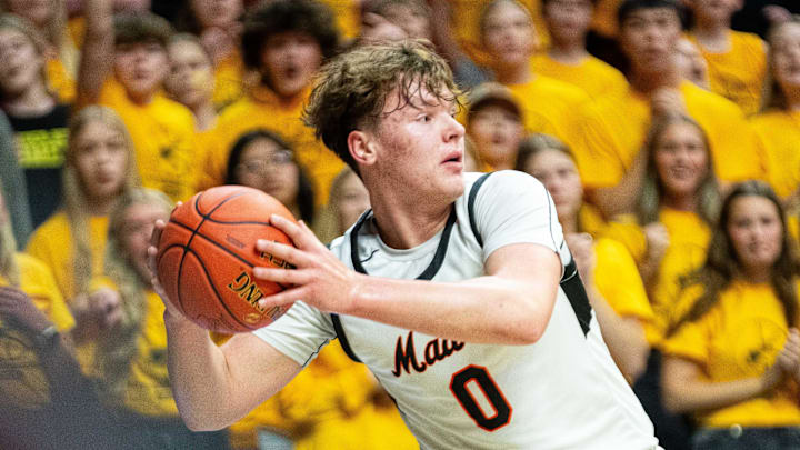 Madrid's Jevyn Severson (0) keeps the ball inbounds during the boys Class 1A state quarterfinal against Boyden Hull on Wednesday, March 12, 2025, at Wells Fargo Arena in Des Moines.