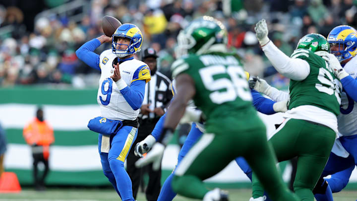 Dec 22, 2024; East Rutherford, New Jersey, USA; Los Angeles Rams quarterback Matthew Stafford (9) throws a pass against the New York Jets during the third quarter at MetLife Stadium. Mandatory Credit: Brad Penner-Imagn Images