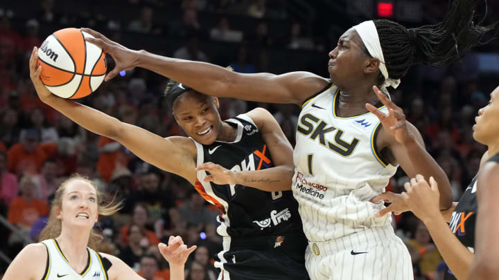 May 21, 2023; Phoenix, Arizona, USA; Chicago Sky guard Elizabeth Williams (10) fouls Phoenix Mercury guard Moriah Jefferson (8) in the first half at Footprint Center. Mandatory Credit: Rick Scuteri-USA TODAY Sports