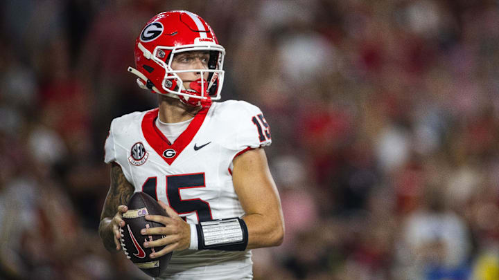 Sep 28, 2024; Tuscaloosa, Alabama, USA; Georgia Bulldogs quarterback Carson Beck (15) drops to throw against the Alabama Crimson Tide during the second quarter at Bryant-Denny Stadium. Mandatory Credit: Will McLelland-Imagn Images
