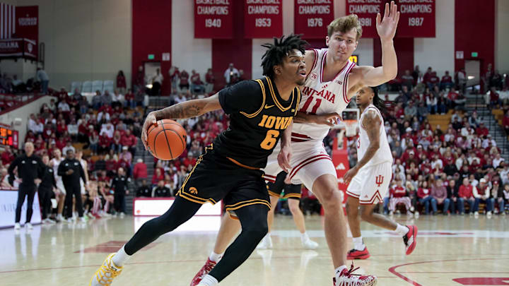 Jan 17, 2026; Bloomington, Indiana, USA; Iowa Hawkeyes guard Tavion Banks (6) goes to the basket against Indiana Hoosiers forward Trent Sisley (11) during the first half at Simon Skjodt Assembly Hall. Mandatory Credit: Robert Goddin-Imagn Images Jan 17, 2026; Bloomington, Indiana, USA; Iowa Hawkeyes guard Tavion Banks (6) goes to the basket against Indiana Hoosiers forward Trent Sisley (11) during the first half at Simon Skjodt Assembly Hall. Mandatory Credit: Robert Goddin-Imagn Images