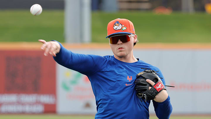 Feb 17, 2026; Port St. Lucie, FL, USA;  New York Mets infielder Jacob Reimer (98) throws the ball during the New York Mets spring training workouts at Clover Park. Mandatory Credit: Reinhold Matay-Imagn Images