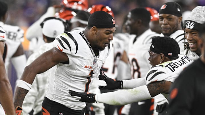 Nov 7, 2024; Baltimore, Maryland, USA; Cincinnati Bengals wide receiver Ja'Marr Chase (1) celebrates with  cornerback Cam Taylor-Britt (29) after scoring a touchdown during the second half against the Baltimore Ravens at M&T Bank Stadium. Mandatory Credit: Tommy Gilligan-Imagn Images