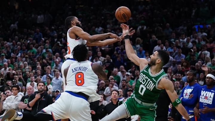 May 7, 2025; Boston, Massachusetts, USA; New York Knicks forward Mikal Bridges (25) defends against Boston Celtics forward Jayson Tatum (0) in the last seconds of the fourth quarter during game two of the second round for the 2025 NBA Playoffs at TD Garden. Mandatory Credit: David Butler II-Imagn Images