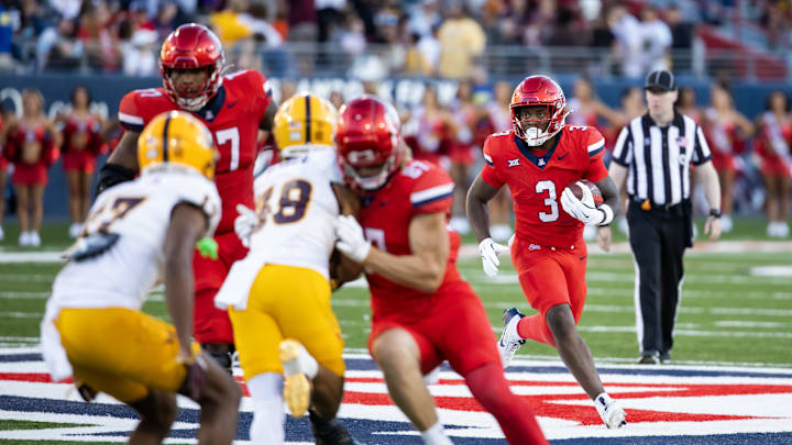 Nov 30, 2024; Tucson, Arizona, USA; Arizona Wildcats running back Kedrick Reescano (3) against the Arizona State Sun Devils during the Territorial Cup at Arizona Stadium. Mandatory Credit: Mark J. Rebilas-Imagn Images