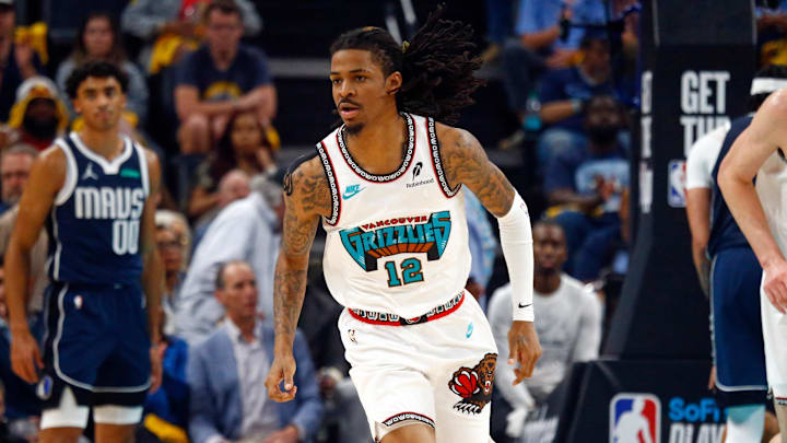 Apr 18, 2025; Memphis, Tennessee, USA; Memphis Grizzlies guard Ja Morant (12) reacts during the second quarter against the Dallas Mavericks at FedExForum. Mandatory Credit: Petre Thomas-Imagn Images