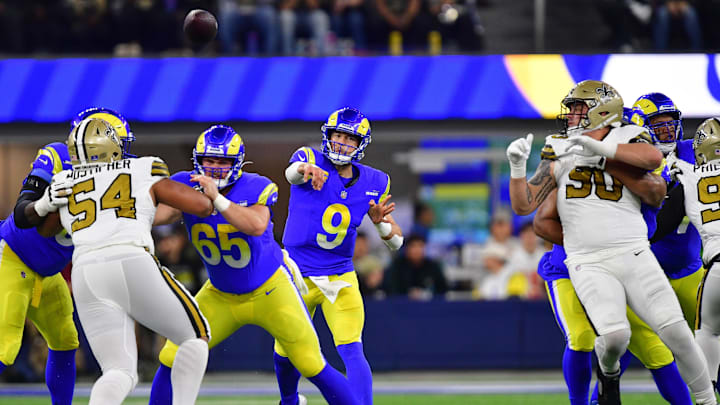 Dec 21, 2023; Inglewood, California, USA; Los Angeles Rams quarterback Matthew Stafford (9) throws as guard Coleman Shelton (65) provides coverage against New Orleans Saints defensive tackle PJ Mustipher (54) during the first half at SoFi Stadium. Mandatory Credit: Gary A. Vasquez-Imagn Images Dec 21, 2023; Inglewood, California, USA; Los Angeles Rams quarterback Matthew Stafford (9) throws as guard Coleman Shelton (65) provides coverage against New Orleans Saints defensive tackle PJ Mustipher (54) during the first half at SoFi Stadium. Mandatory Credit: Gary A. Vasquez-Imagn Images