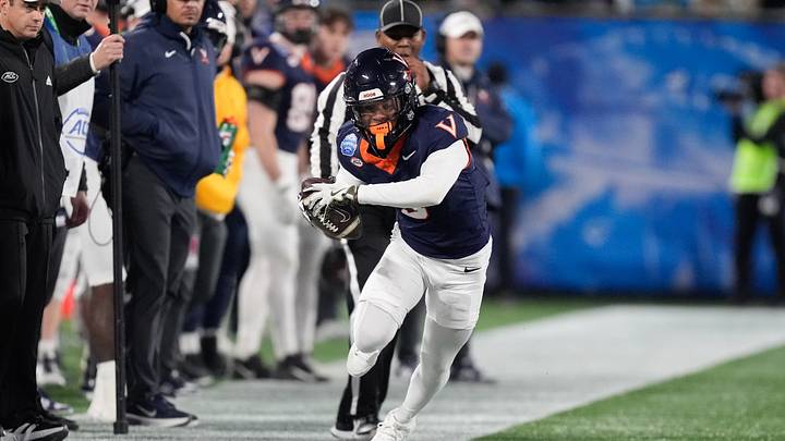 Dec 6, 2025; Charlotte, NC, USA; Virginia Cavaliers wide receiver Kameron Courtney (5) attempts to stay in bounds after catching a pass in the second quarter against the Duke Blue Devils during the 2025 ACC Championship game at Bank of America Stadium. Mandatory Credit: Jim Dedmon-Imagn Images Dec 6, 2025; Charlotte, NC, USA; Virginia Cavaliers wide receiver Kameron Courtney (5) attempts to stay in bounds after catching a pass in the second quarter against the Duke Blue Devils during the 2025 ACC Championship game at Bank of America Stadium. Mandatory Credit: Jim Dedmon-Imagn Images