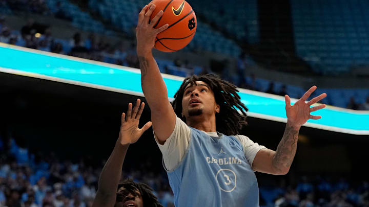Oct 12, 2024; Chapel Hill, NC, USA;  North Carolina Tar Heels guard Elliot Cadeau (3) shoots in the first half at the Dean E. Smith Center. Mandatory Credit: Bob Donnan-Imagn Images