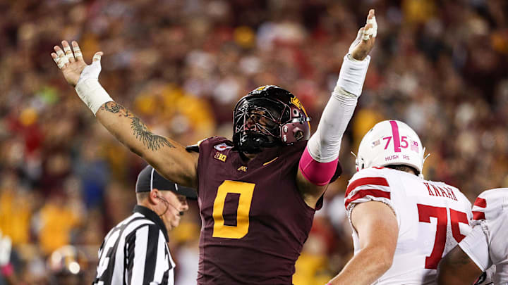 Oct 17, 2025; Minneapolis, Minnesota, USA; Minnesota Golden Gophers defensive lineman Anthony Smith (0) celebrates a sack against Nebraska Cornhuskers quarterback Dylan Raiola (15) during the first half at Huntington Bank Stadium. Mandatory Credit: Matt Krohn-Imagn Images