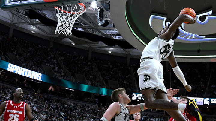  Mar 2, 2025; East Lansing, Michigan, USA;  Michigan State Spartans forward Coen Carr (55) goes up for a dunk that brought the crowd to their feet against the Wisconsin Badgers during the second half at Jack Breslin Student Events Center. Mandatory Credit: Dale Young-Imagn Images