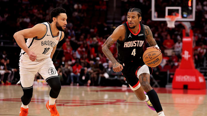 Feb 1, 2025; Houston, Texas, USA; Houston Rockets guard Jalen Green (4) handles the ball against Brooklyn Nets guard Ben Simmons (10) during the first quarter at Toyota Center. Mandatory Credit: Erik Williams-Imagn Images