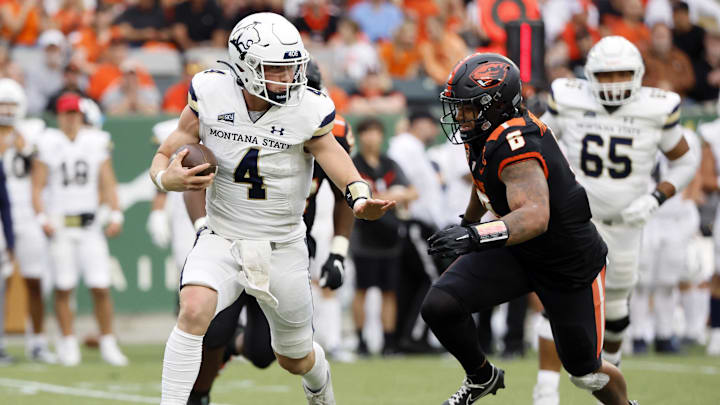 Sep 17, 2022; Portland, Oregon, USA; Montana State Bobcats quarterback Tommy Mellott (4) scrambles under pressure from Oregon State Beavers linebacker John McCartan (6) during the first half at Providence Park. Mandatory Credit: Soobum Im-Imagn Images Sep 17, 2022; Portland, Oregon, USA; Montana State Bobcats quarterback Tommy Mellott (4) scrambles under pressure from Oregon State Beavers linebacker John McCartan (6) during the first half at Providence Park. Mandatory Credit: Soobum Im-Imagn Images