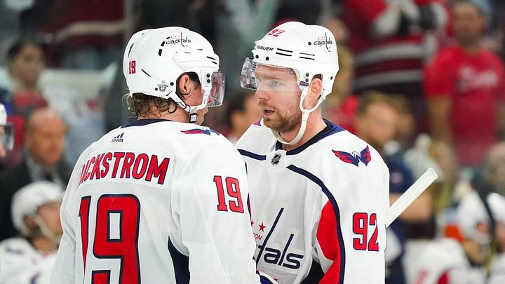 Apr 18, 2019; Raleigh, NC, USA;  Washington Capitals center Nicklas Backstrom (19) and center Evgeny Kuznetsov (92) talk against the Carolina Hurricanes in game four of the first round of the 2019 Stanley Cup Playoffs at PNC Arena. The Carolina Hurricanes defeated the Washington Capitals 2-1. Mandatory Credit: James Guillory-Imagn Images