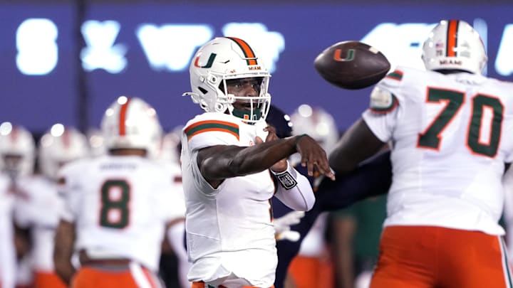 Oct 5, 2024; Berkeley, California, USA; Miami Hurricanes quarterback Cam Ward (1) throws a pass against the California Golden Bears during the first quarter at California Memorial Stadium. Mandatory Credit: Darren Yamashita-Imagn Images