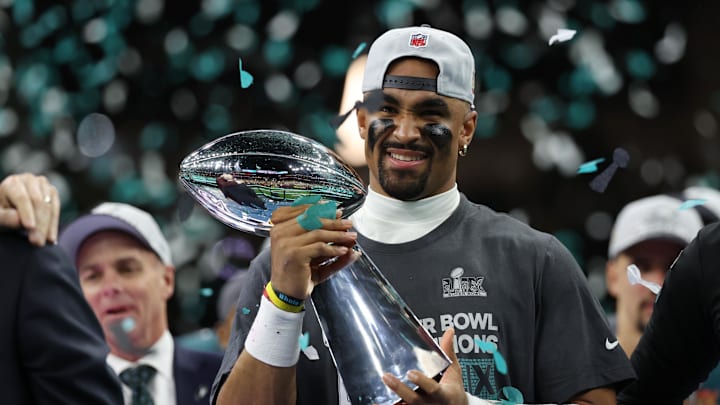 Feb 9, 2025; New Orleans, LA, USA; Philadelphia Eagles quarterback Jalen Hurts holds the Lombardi Trophy during the championship trophy presentation after the Eagles' game against the Kansas City Chiefs in Super Bowl LIX at Caesars Superdome. Mandatory Credit: Geoff Burke-Imagn Images