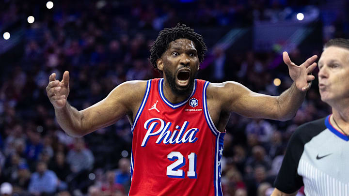 Nov 12, 2024; Philadelphia, Pennsylvania, USA; Philadelphia 76ers center Joel Embiid (21) reacts to a play against the New York Knicks during the third quarter at Wells Fargo Center. Mandatory Credit: Bill Streicher-Imagn Images Nov 12, 2024; Philadelphia, Pennsylvania, USA; Philadelphia 76ers center Joel Embiid (21) reacts to a play against the New York Knicks during the third quarter at Wells Fargo Center. Mandatory Credit: Bill Streicher-Imagn Images