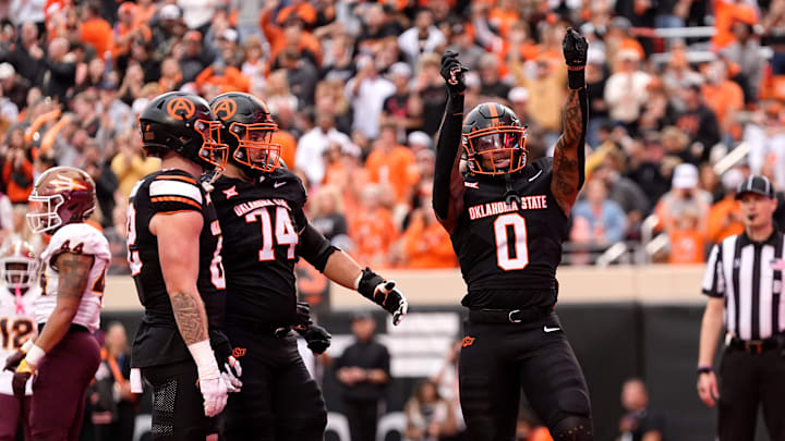 Oklahoma State Cowboys running back Ollie Gordon II (0) celebrates a touchdown in the first half of the college football game between the Oklahoma State Cowboys and the Arizona State Sun Devils at Boone Pickens Stadium in Stillwater, Okla., Saturday, Nov., 2, 2024. Oklahoma State Cowboys running back Ollie Gordon II (0) celebrates a touchdown in the first half of the college football game between the Oklahoma State Cowboys and the Arizona State Sun Devils at Boone Pickens Stadium in Stillwater, Okla., Saturday, Nov., 2, 2024.
