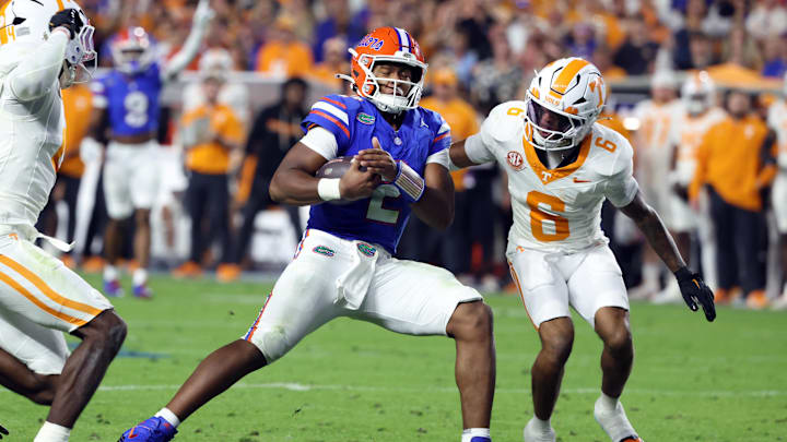 Nov 22, 2025; Gainesville, Florida, USA; Florida Gators quarterback DJ Lagway (2) runs past Tennessee Volunteers defensive back Jalen McMurray (6) during the first half at Ben Hill Griffin Stadium. Mandatory Credit: Kim Klement Neitzel-Imagn Images Nov 22, 2025; Gainesville, Florida, USA; Florida Gators quarterback DJ Lagway (2) runs past Tennessee Volunteers defensive back Jalen McMurray (6) during the first half at Ben Hill Griffin Stadium. Mandatory Credit: Kim Klement Neitzel-Imagn Images