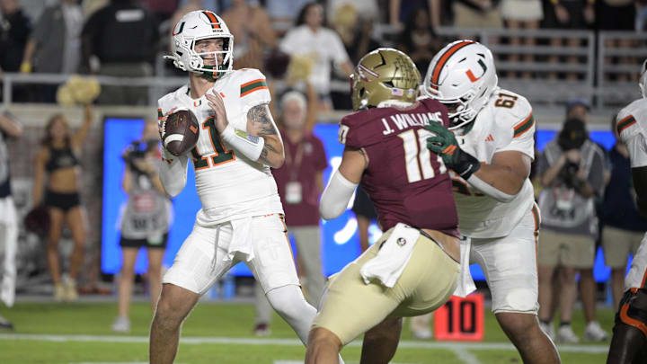 Oct 4, 2025; Tallahassee, Florida, USA; Miami Hurricanes quarterback Carson Beck (11) throws during the first half against the Florida State Seminoles at Doak S. Campbell Stadium. Mandatory Credit: Melina Myers-Imagn Images