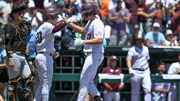 Jun 23, 2024; Omaha, NE, USA; Texas A&M Aggies right fielder Jace Laviolette (17) celebrates hitting a home run with outfielder Colby Backus (20) against the Tennessee Volunteers during the first inning at Charles Schwab Field Omaha. Mandatory Credit: Steven Branscombe-USA TODAY Sports Jun 23, 2024; Omaha, NE, USA; Texas A&M Aggies right fielder Jace Laviolette (17) celebrates hitting a home run with outfielder Colby Backus (20) against the Tennessee Volunteers during the first inning at Charles Schwab Field Omaha. Mandatory Credit: Steven Branscombe-USA TODAY Sports