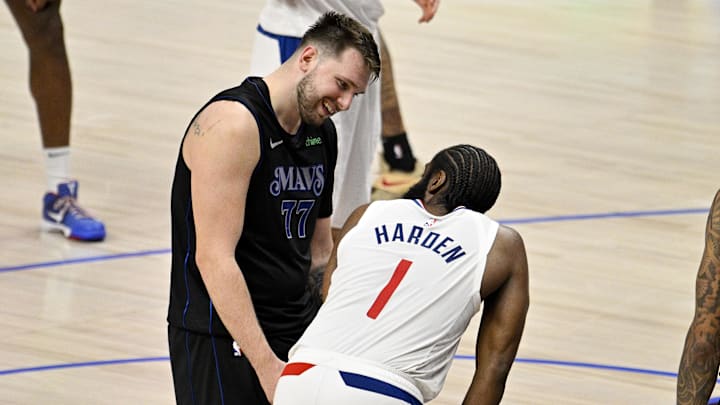 May 3, 2024; Dallas, Texas, USA; Dallas Mavericks guard Luka Doncic (77) jokes with LA Clippers guard James Harden (1) during the fourth quarter during game six of the first round for the 2024 NBA playoffs at American Airlines Center. Mandatory Credit: Jerome Miron-Imagn Images