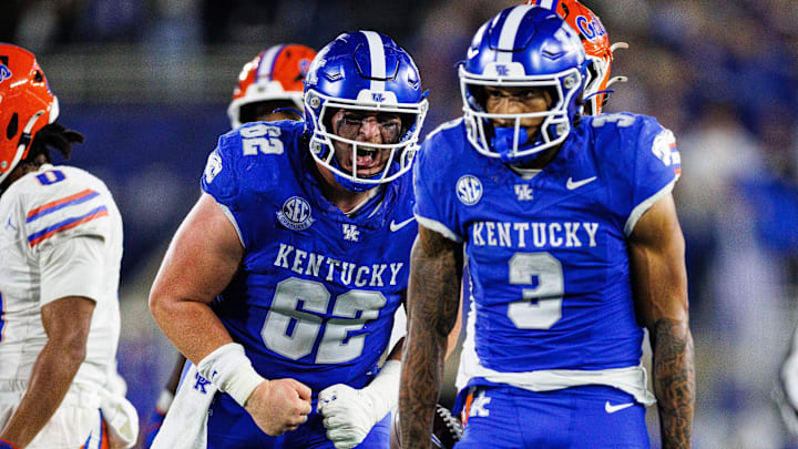 Nov 8, 2025; Lexington, Kentucky, USA; Kentucky Wildcats offensive lineman Jager Burton (62) celebrates after a drive by running back Seth McGowan (3) during the third quarter against the Florida Gators at Kroger Field. Mandatory Credit: Jordan Prather-Imagn Images Nov 8, 2025; Lexington, Kentucky, USA; Kentucky Wildcats offensive lineman Jager Burton (62) celebrates after a drive by running back Seth McGowan (3) during the third quarter against the Florida Gators at Kroger Field. Mandatory Credit: Jordan Prather-Imagn Images
