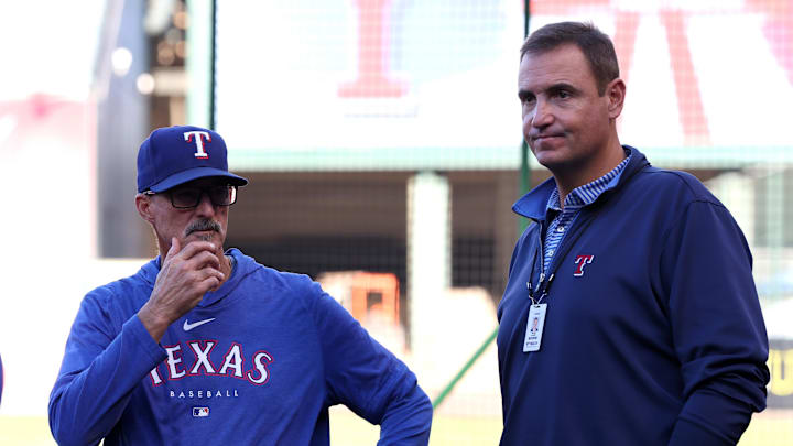 Texas Rangers pitching coach Mike Maddux (31) talks with general manager Chris Young (right) prior to a game against the Los Angeles Angels at Angel Stadium. Texas Rangers pitching coach Mike Maddux (31) talks with general manager Chris Young (right) prior to a game against the Los Angeles Angels at Angel Stadium.