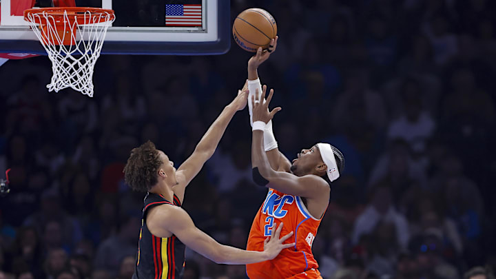 Dec 29, 2025; Oklahoma City, Oklahoma, USA; Oklahoma City Thunder guard Shai Gilgeous-Alexander (2) shoots as Atlanta Hawks guard Dyson Daniels (5) defends the shot during the first quarter at Paycom Center. Mandatory Credit: Alonzo Adams-Imagn Images Dec 29, 2025; Oklahoma City, Oklahoma, USA; Oklahoma City Thunder guard Shai Gilgeous-Alexander (2) shoots as Atlanta Hawks guard Dyson Daniels (5) defends the shot during the first quarter at Paycom Center. Mandatory Credit: Alonzo Adams-Imagn Images