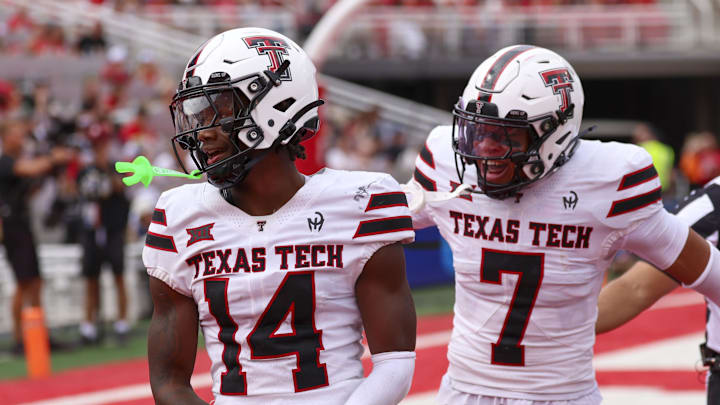 Sep 20, 2025; Salt Lake City, Utah, USA; Texas Tech Red Raiders defensive back Brice Pollock (14) and defensive back Brenden Jordan (7) react to a defensive stop against the Utah Utes during the third quarter at Rice-Eccles Stadium. Mandatory Credit: Rob Gray-Imagn Images