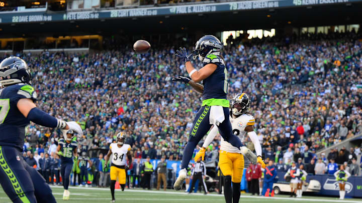 Dec 31, 2023; Seattle, Washington, USA; Seattle Seahawks wide receiver Jaxon Smith-Njigba (11) catches a pass for a touchdown against the Pittsburgh Steelers during the first half at Lumen Field. Mandatory Credit: Steven Bisig-Imagn Images