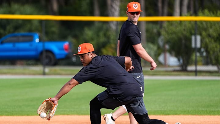 Detroit Tigers infielder Hao-Yu Lee, left, works out at third base next to infielder Jace Jung during spring training at TigerTown in Lakeland, Fla. on Sunday, Feb. 16, 2025.