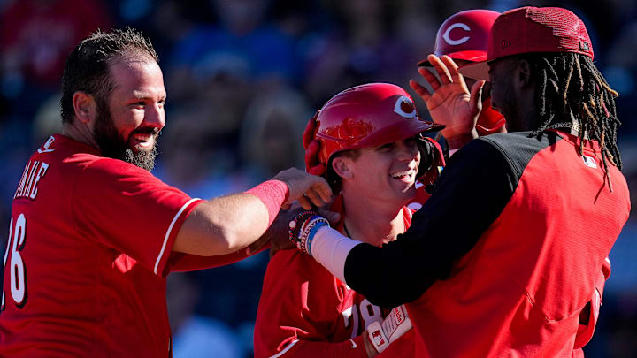 Cincinnati Reds mob shortstop Matt McLain (78) after his walk-off solo home run.