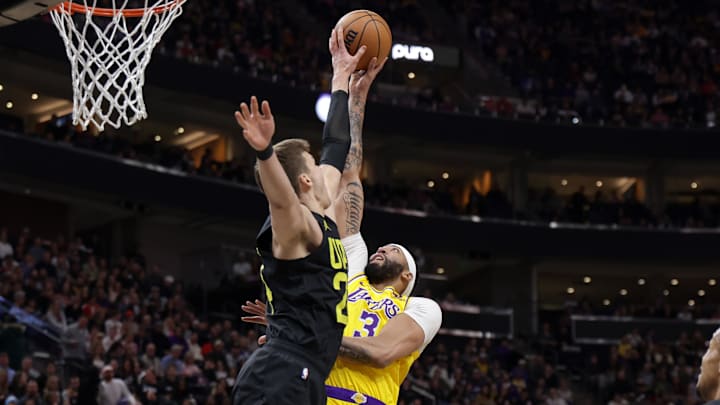 Feb 14, 2024; Salt Lake City, Utah, USA;  Utah Jazz center Walker Kessler (24) blocks the shot of Los Angeles Lakers forward Anthony Davis (3) during the first quarter at Delta Center. Mandatory Credit: Chris Nicoll-Imagn Images