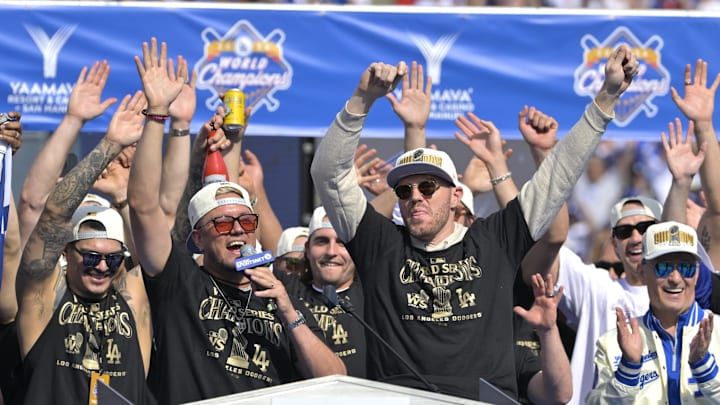 Nov 1, 2024; Los Angeles, CA, USA;  Los Angeles Dodgers shortstop Miguel Rojas (11) and first base Freddie Freeman (5) during the World Series Championship Celebration at Dodger Stadium. Mandatory Credit: Jayne Kamin-Oncea-Imagn Images