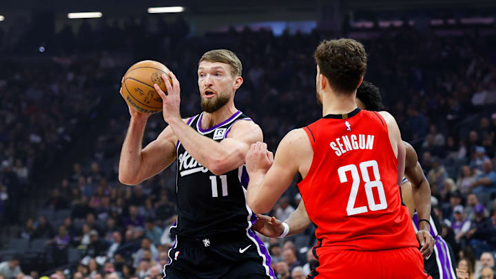 Jan 16, 2025; Sacramento, California, USA; Sacramento Kings forward Domantas Sabonis (11) controls the ball against Houston Rockets center Alperen Sengun (28) during the first quarter at Golden 1 Center. Mandatory Credit: Sergio Estrada-Imagn Images