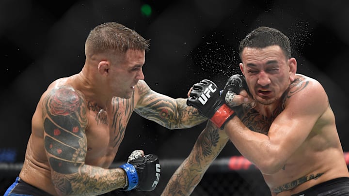 Apr 13, 2019; Atlanta, GA, USA; (EDITORS NOTE: GRAPHIC CONTENT) Max Holloway (red gloves) fights Dustin Poirier (blue gloves) during UFC 236 at State Farm Arena. Poirier won by unanimous decision. Mandatory Credit: John David Mercer-Imagn Images Apr 13, 2019; Atlanta, GA, USA; (EDITORS NOTE: GRAPHIC CONTENT) Max Holloway (red gloves) fights Dustin Poirier (blue gloves) during UFC 236 at State Farm Arena. Poirier won by unanimous decision. Mandatory Credit: John David Mercer-Imagn Images