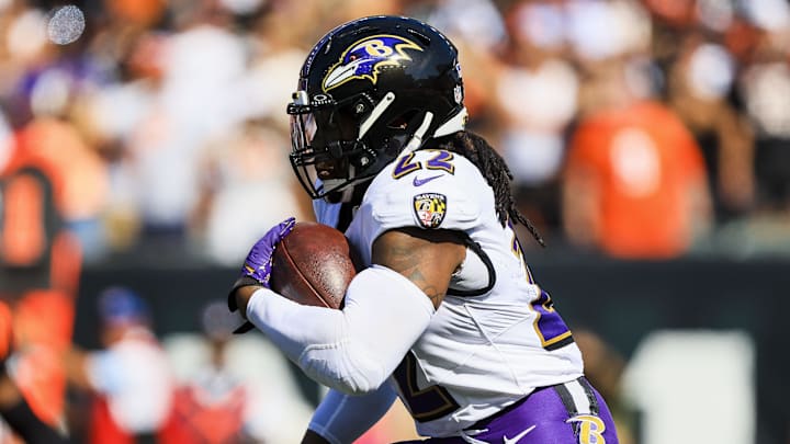 Oct 6, 2024; Cincinnati, Ohio, USA; Baltimore Ravens running back Derrick Henry (22) runs with the ball against the Cincinnati Bengals in the first half at Paycor Stadium. Mandatory Credit: Katie Stratman-Imagn Images